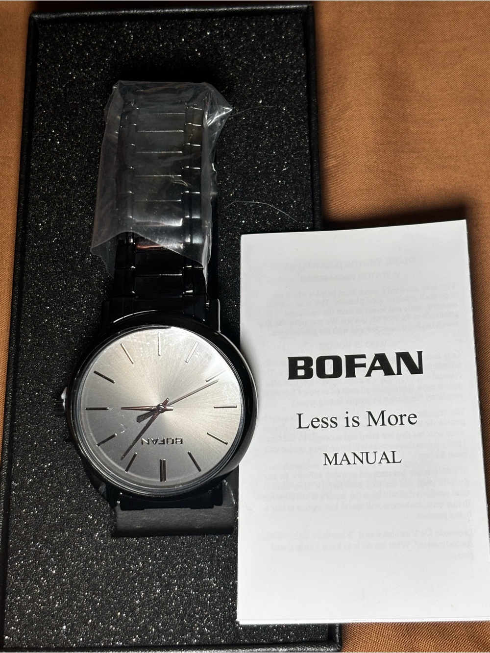 BOFAN Minimalist Stainless Steel Watch.
- Silver Dial, Black Band